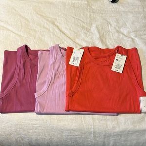 3 A New Day Ribbed Tanks